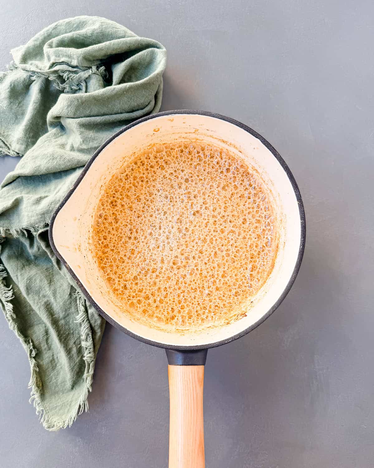 A pot of whisked pumpkin spice milk.