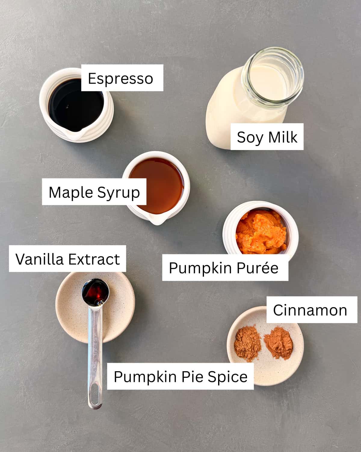 Vegan pumpkin spice latte ingredients laid out separately with labels.