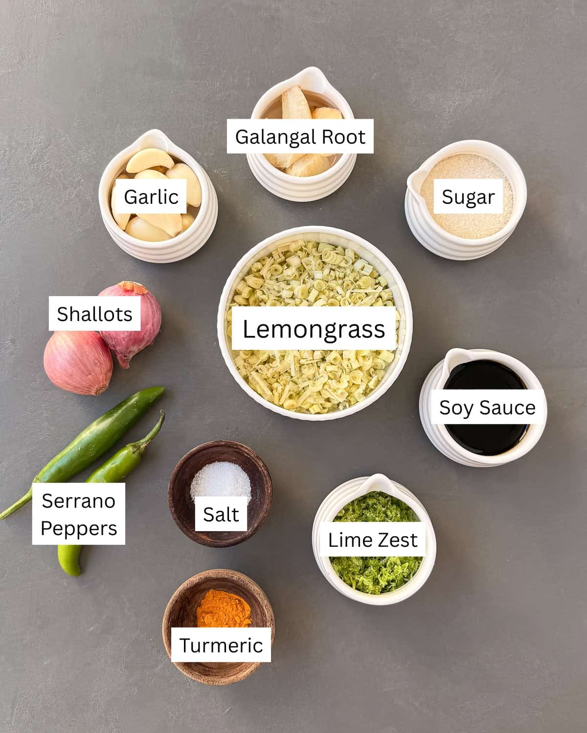 Lemongrass paste ingredients laid out individually with labels.