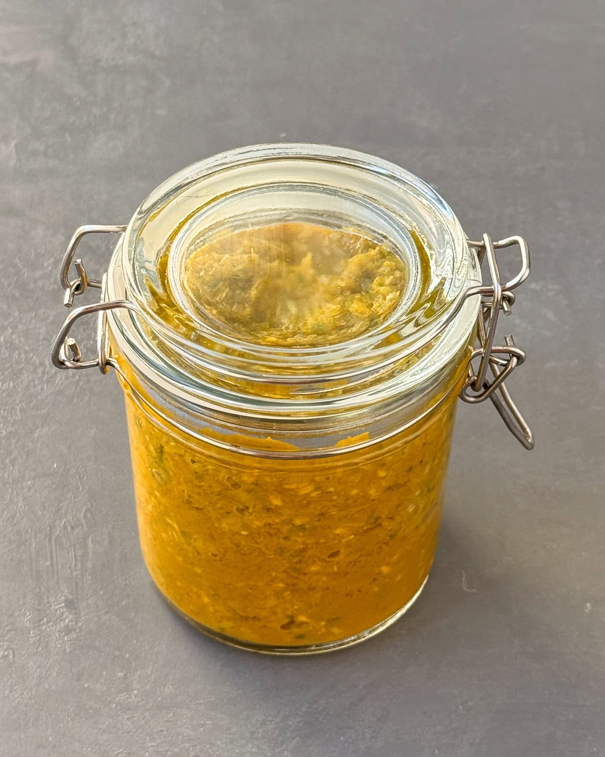 Lemongrass paste inside a sealed glass jar.