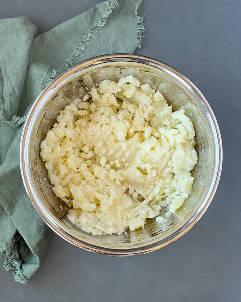 Mashed potatoes in a mixing bowl.
