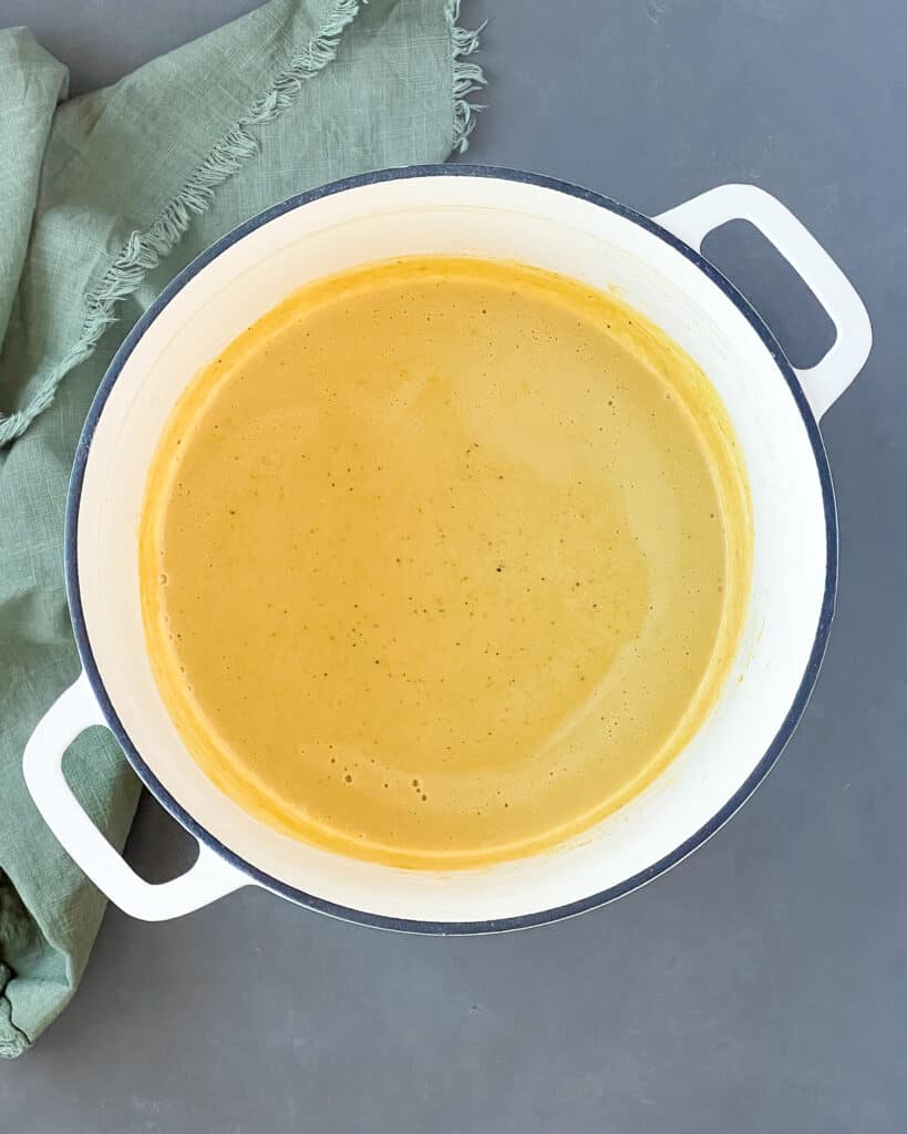 Almond milk cheese sauce in a dutch oven.